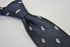 navy tie with medieval knight helmet design